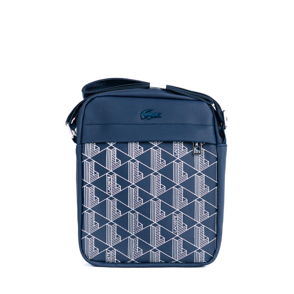Navy blue crossbody bag with geometric pattern on a white background